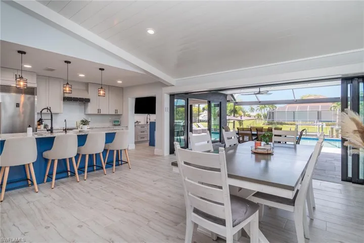 Open concept featuring tile plank floors.