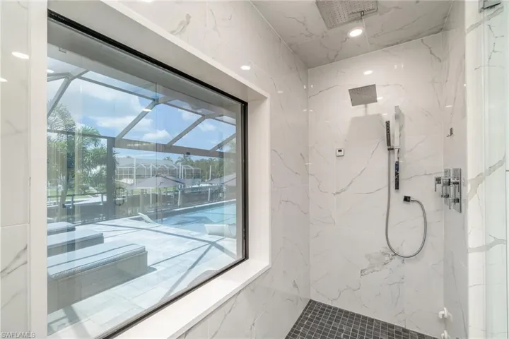 Custom steam shower, two rain heads, handheld, steams up to 120 degrees