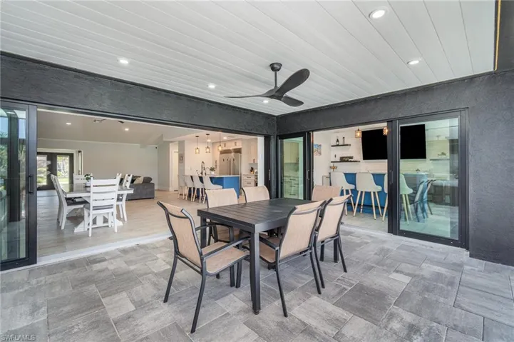 Paved Lanai with 16’ pocket sliding doors open entire wall to the pool area, as well as a 12’ and 6’ sliding door opening to the pool.
