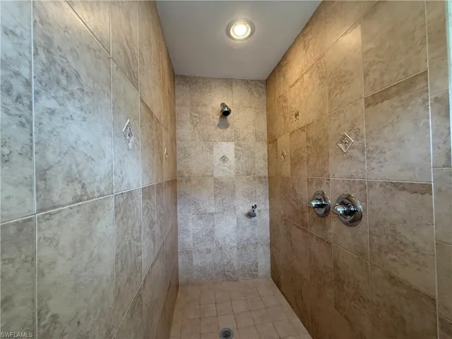 Bathroom featuring tiled shower