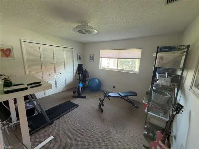 Exercise area with a textured ceiling