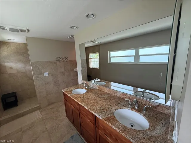 Bathroom with walk in shower and double vanity