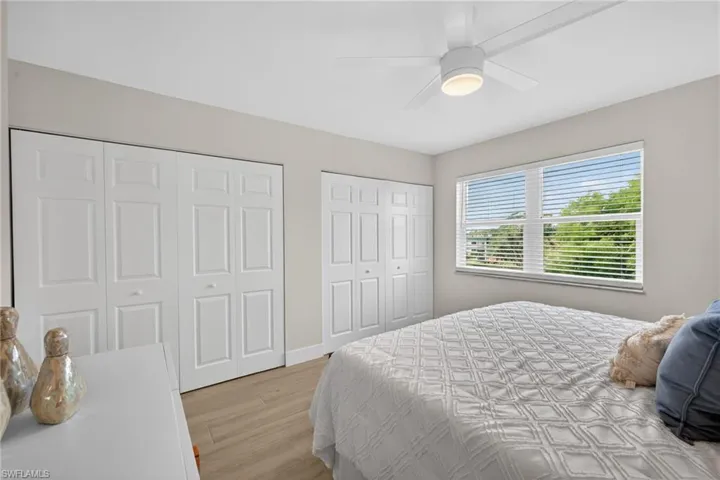 Master Bedroom with tile floors and ceiling fan