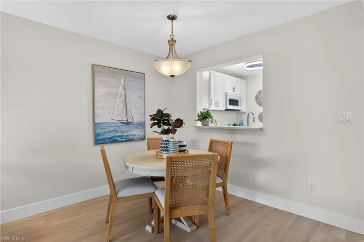 Dining room with tile floors and chandelier