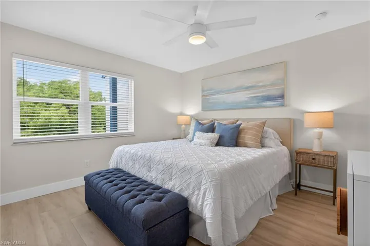 Master Bedroom with tile floors and ceiling fan