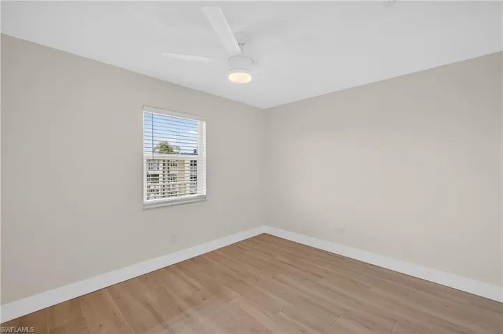 Guest Bedroom with tile floors and ceiling fan