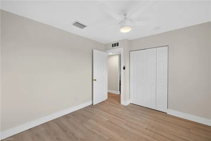 Guest Bedroom with tile floors and ceiling fan