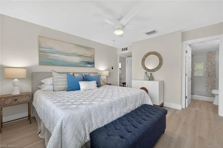 Master Bedroom with tile floors and ceiling fan