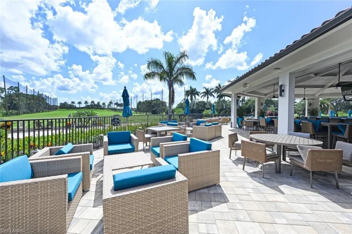 View of patio featuring outdoor dining area, an outdoor hangout area, golf course view, and a ceiling fan