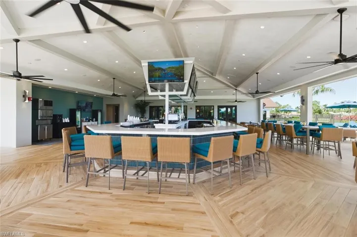 Kitchen featuring open floor plan, ceiling fan, recessed lighting, beamed ceiling, and light countertops