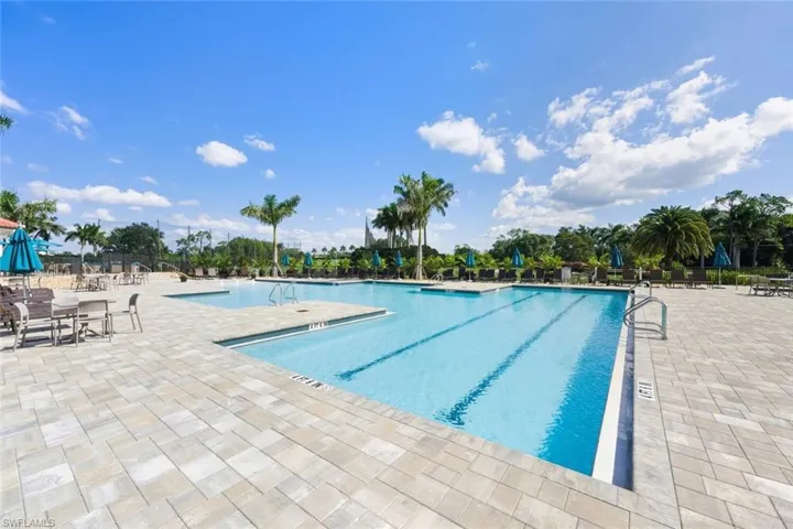 Community pool featuring a patio