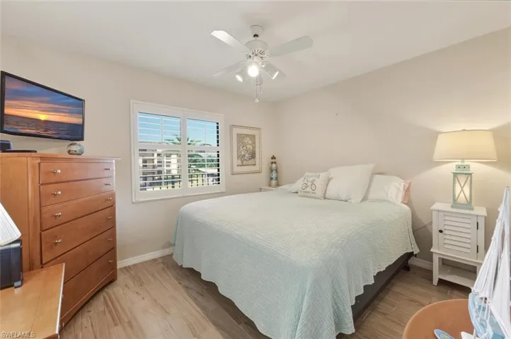 Bedroom featuring light wood-style floors and a ceiling fan