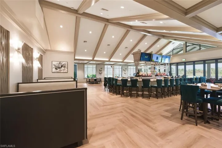 Common area with high vaulted ceiling, beam ceiling, and recessed lighting