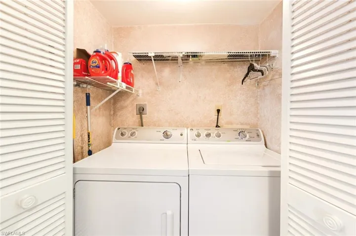 Washroom featuring washer and dryer