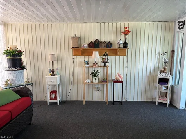 Miscellaneous room with wood ceiling and carpet floors