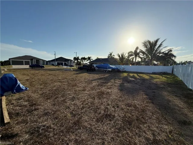 Fenced yard with a residential view