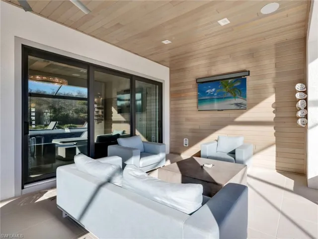 Covered Lanai Seating Area With Custom Wall & Ceiling Treatment & WHOLE-HOME SONOS AUDIO With In-Ceiling Speakers & Soundbars, and Wi-Fi Extenders