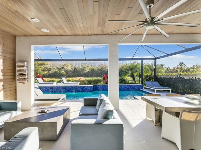 Covered Lanai With Custom Porcelain Paver Flooring, Custom Wall & Ceiling Treatment, WHOLE-HOME SONOS AUDIO With In-Ceiling Speakers & Soundbars, and Wi-Fi Extenders, and Custom Saltwater Pool With Water Feature