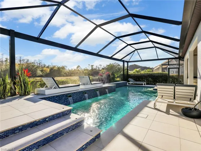 Custom Saltwater Pool With Water Feature Overlooking a Lake & Preserve Private Setting
