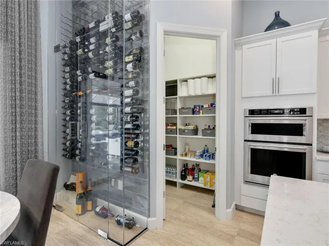 Custom Tile & Glass Wine Wall & Walk-In Pantry With Custom Shelving