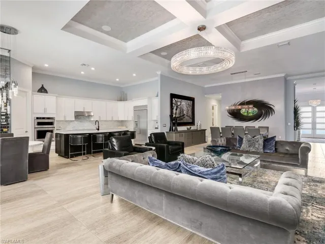 Great Room With Coffered Ceiling, WHOLE-HOME SONOS AUDIO With In-Ceiling Speakers & Soundbars, and Wi-Fi Extenders, Custom Tile & Glass Wine Wall, Kitchen With Large Island, Walk-In Pantry, KitchenAid Stainless Steel Appliances, Built-In Refrigerator, and Eat-In Kitchen