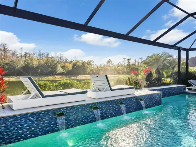 Custom Saltwater Pool with Water Feature Overlooking a Lake & Preserve Private Setting