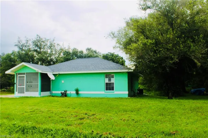 View of front of property with a front lawn