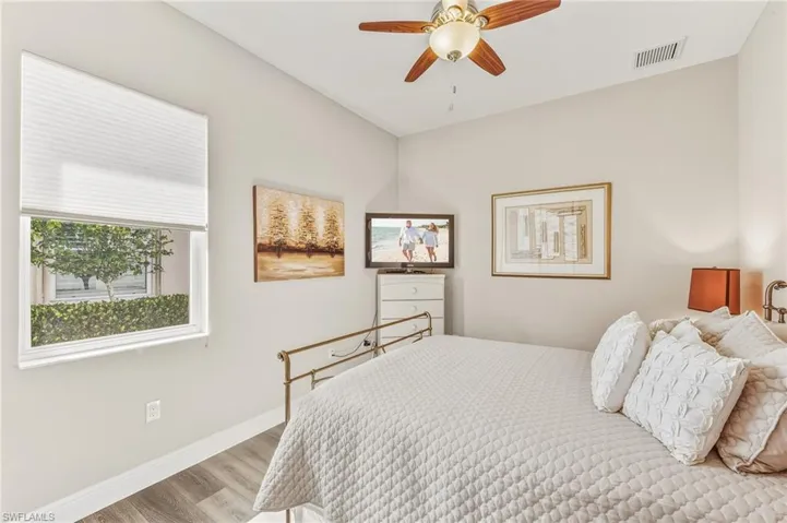 Bedroom featuring wood finished floors and ceiling fan