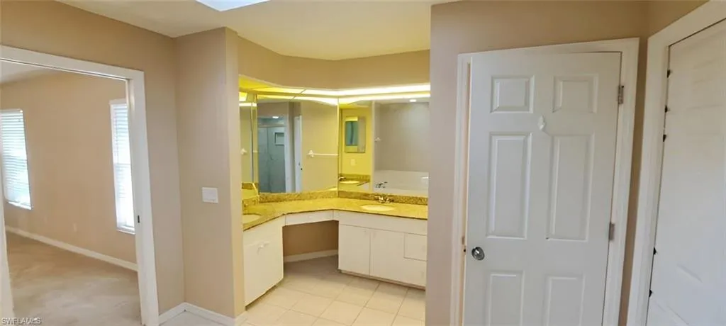 Bathroom with vanity and tile patterned floors