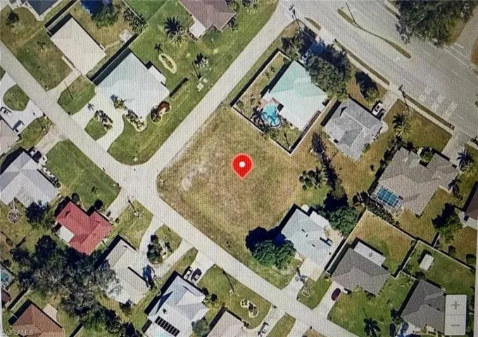 Aerial overview of property's location with nearby suburban area