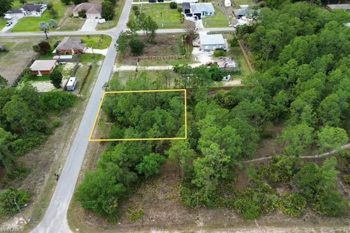 Wooded lot featuring mature trees and street frontage