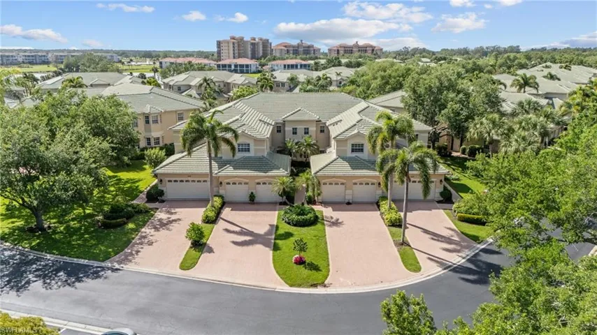 Community setting featuring mature trees and lush landscaping