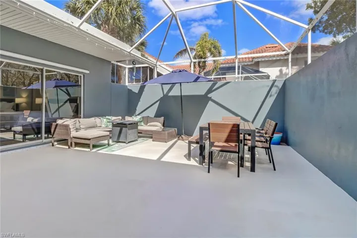 View of patio / terrace with outdoor dining area, a lanai, and a sunroom