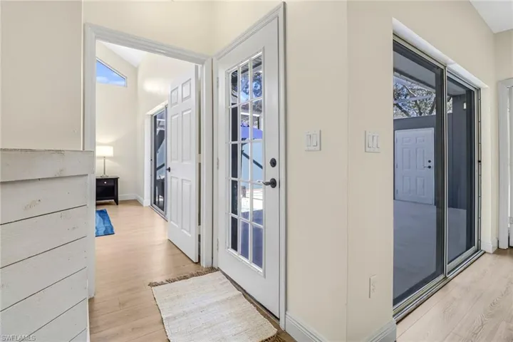 Entryway featuring plenty of natural light and wood finished floors