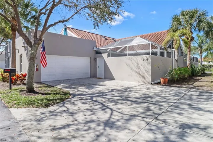 Mediterranean / spanish-style house with a lanai, stucco siding, concrete driveway, a garage, and a tiled roof