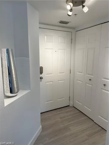 Entryway with wood finished floors
