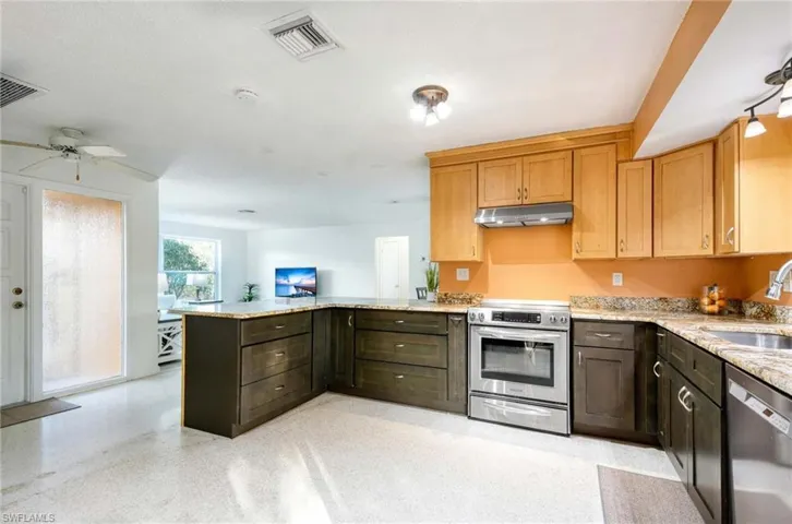 Two-toned Solid Wood Cabinets with Level 4 Granite Countertops