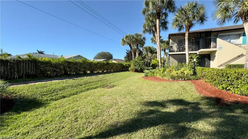 View of yard featuring a balcony