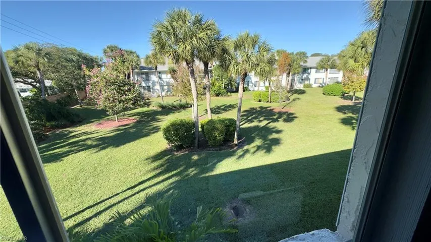 View of green lawn from living room