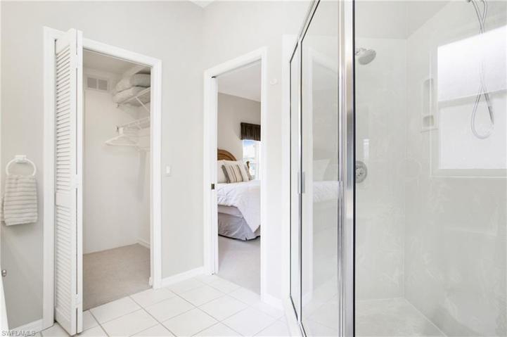 Ensuite to primary bedroom shows large walk-in closet