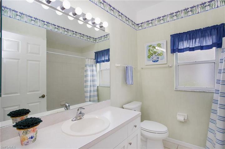 2nd Bathroom has tub/shower combo and large vanity for guests.
