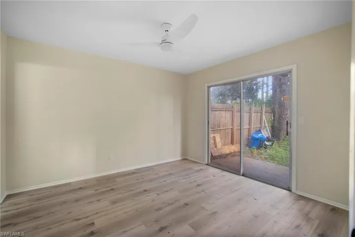 Unfurnished room with light hardwood / wood-style flooring and ceiling fan