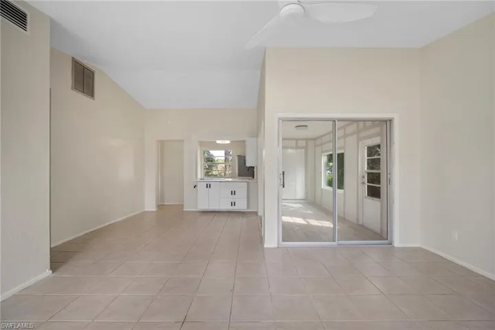 Unfurnished living room featuring light tile patterned flooring