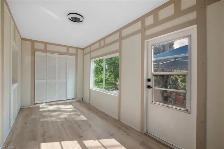 Spare room with light wood-type flooring