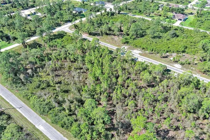 View of property location featuring a heavily wooded area