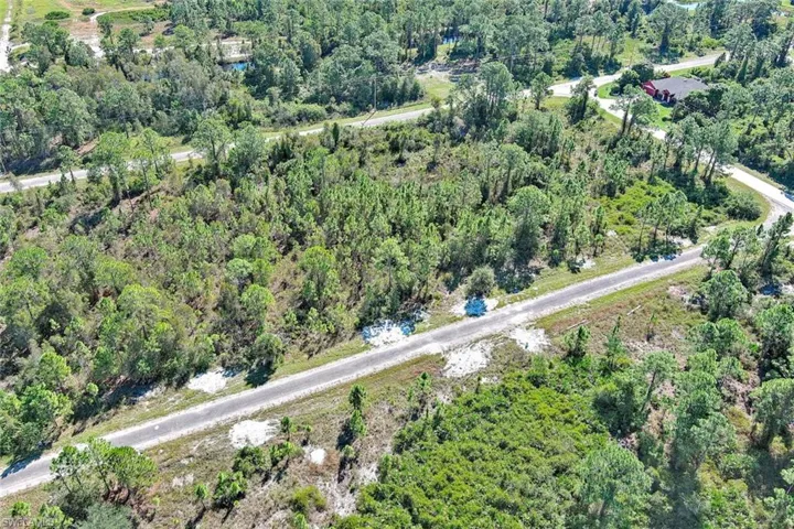 Aerial overview of property's location with a forest