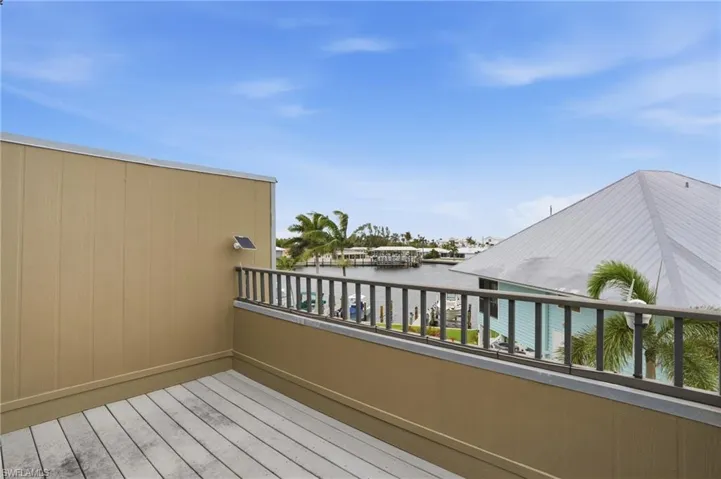 1 of 2 balconies off master overlooking boat slips