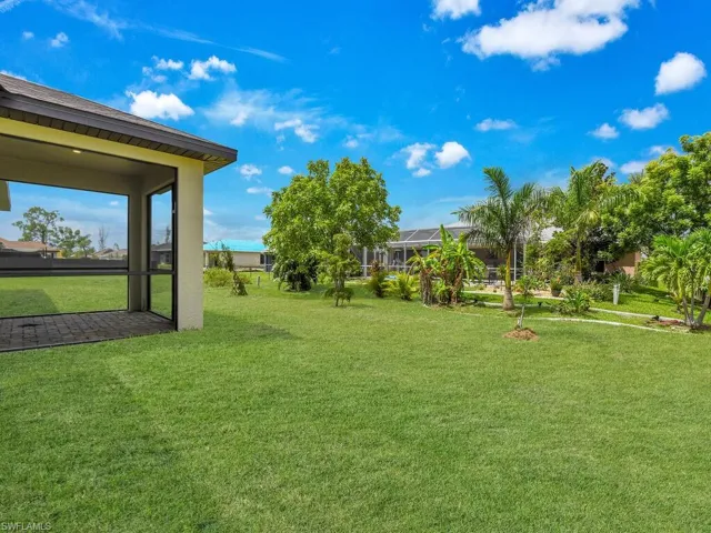 View of yard featuring a lanai