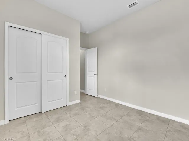 Unfurnished bedroom featuring a closet