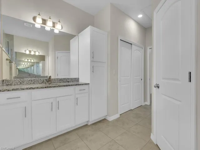 Bathroom featuring vanity and tile patterned floors